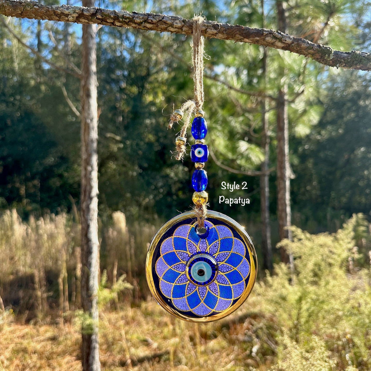 Round blue evil eye wall hanging with gold trim, papatya geometric flower disc and beads