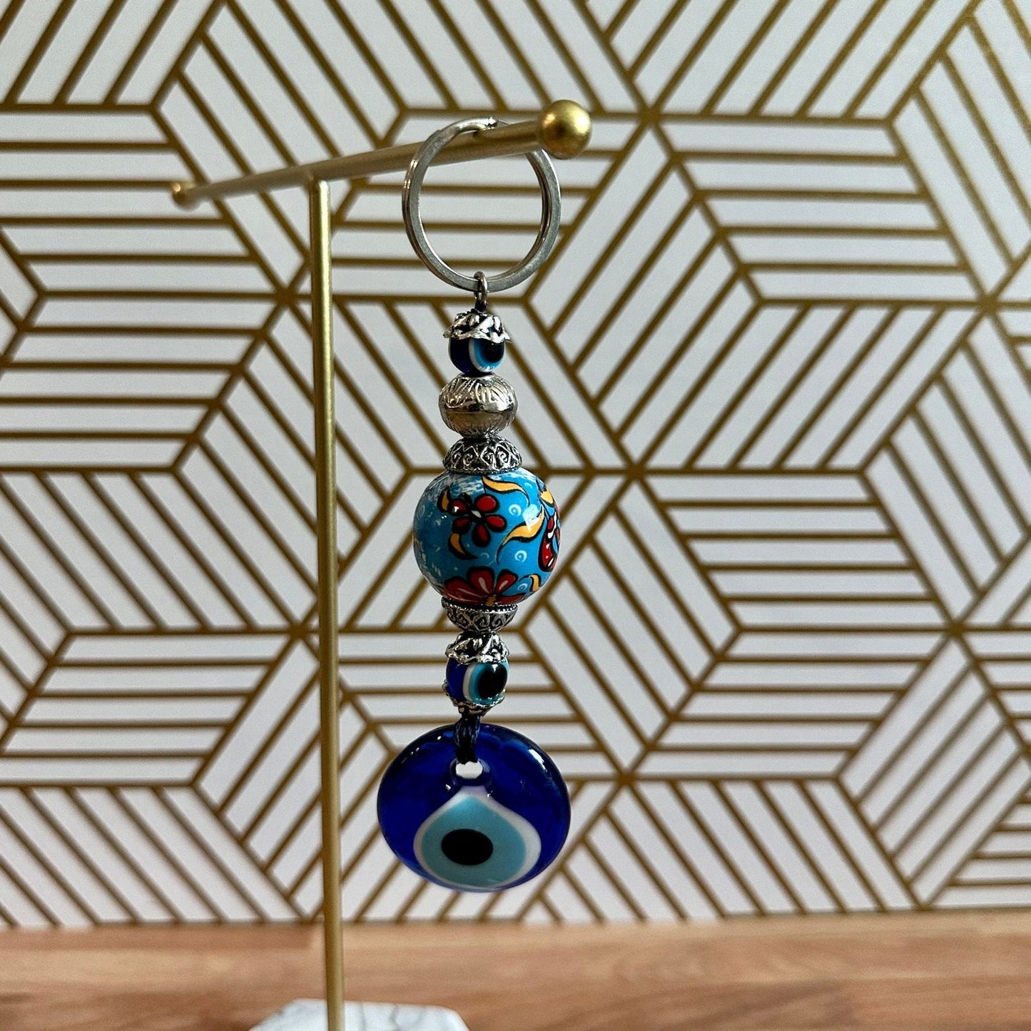 Evil eye ceramic ball keychain with light blue floral bead and blue eye charm
