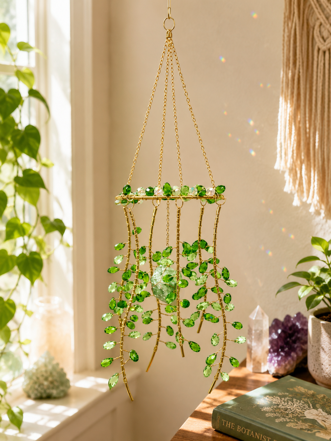 Hanging gold suncatcher with dangling green faceted beads and clear prism centerpiece