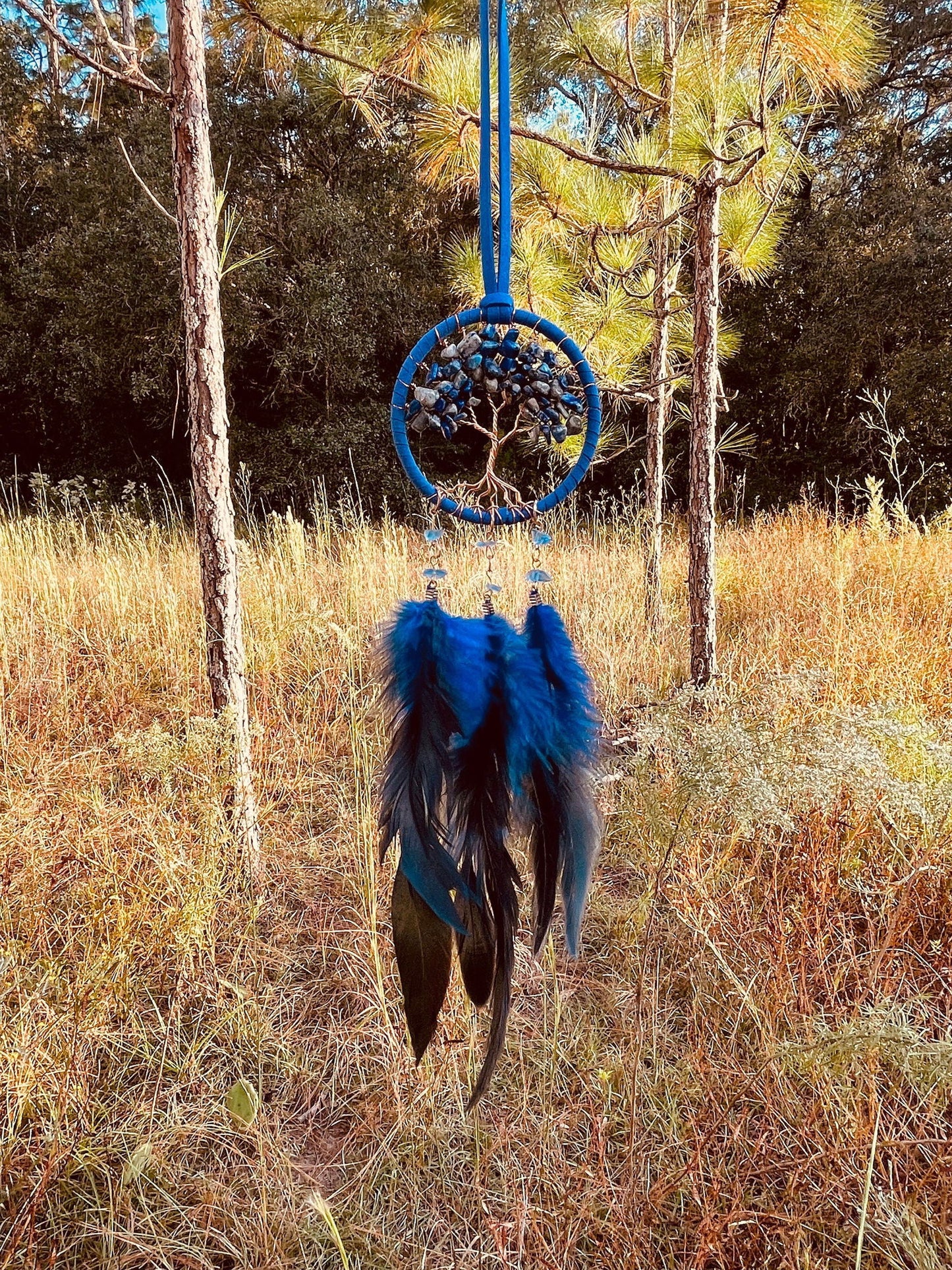 Blue dreamcatcher wall hanging with beaded Tree of Life and blue feathers