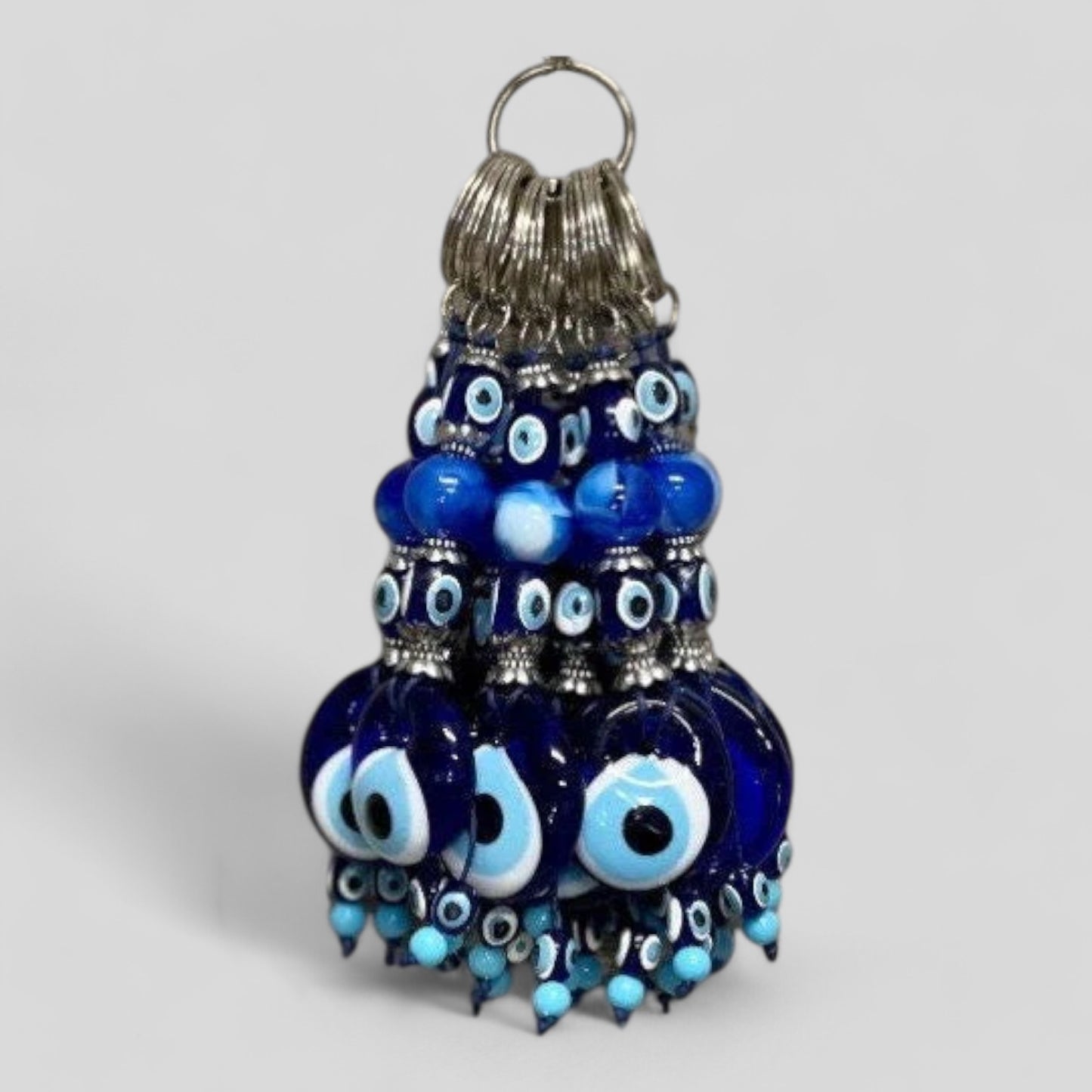Handcrafted glass evil eye keychain with blue bead tassel and metal key ring