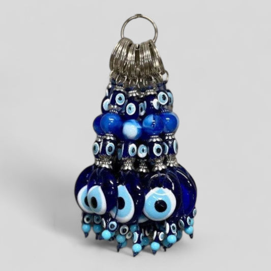 Handcrafted glass evil eye keychain with blue bead tassel and metal key ring