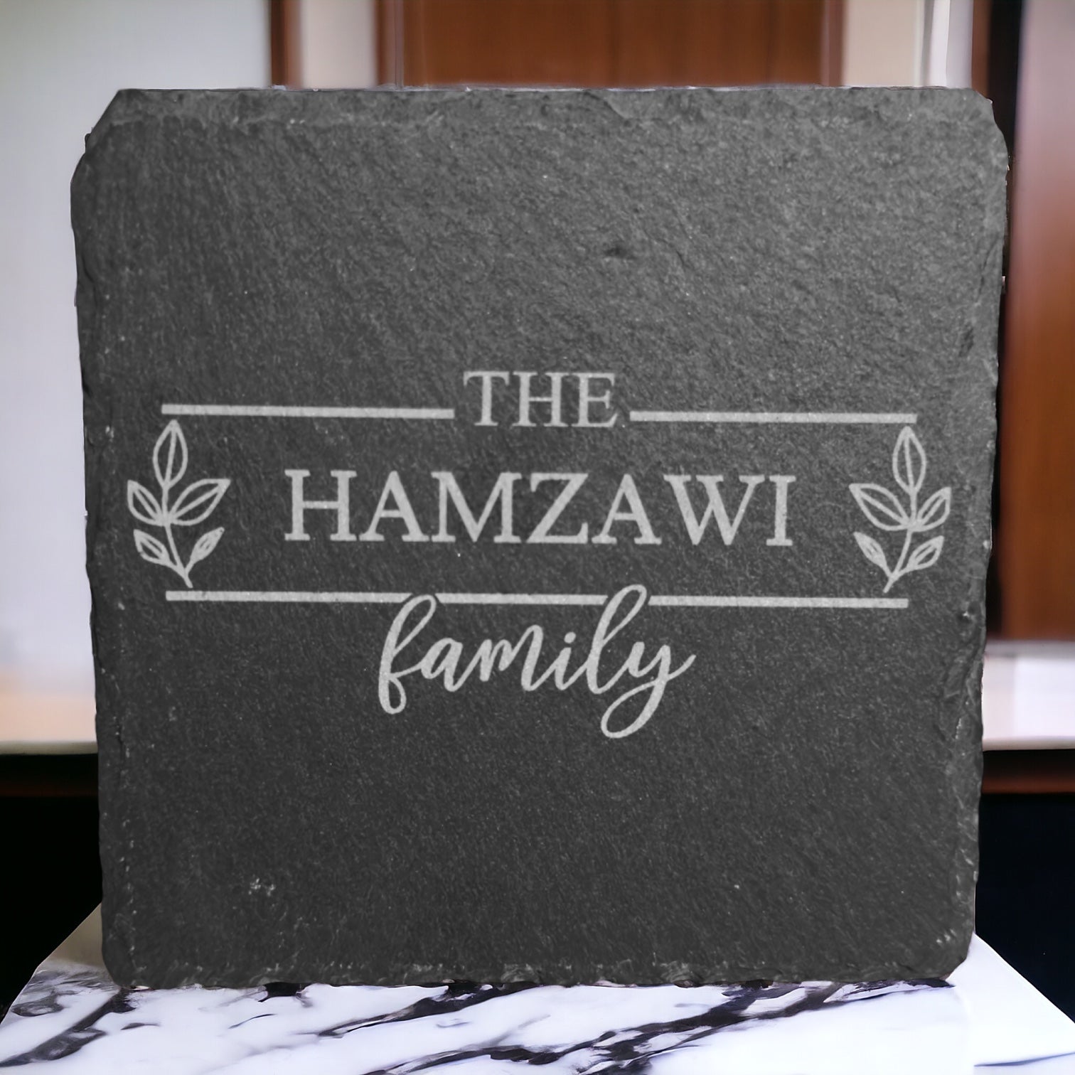 Slate coaster with engraved "THE HAMZAWI family" wording
