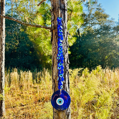 Blue evil eye bead hanging charm with macrame string and single round eye disc