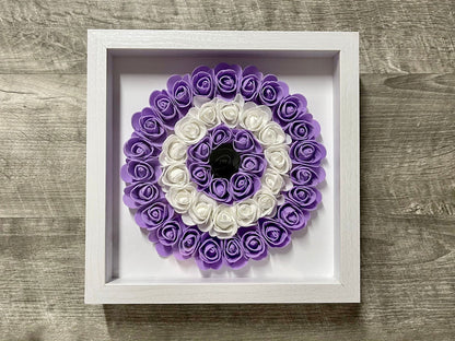 Handmade evil eye rose shadowbox with green and white coil rosette in white frame