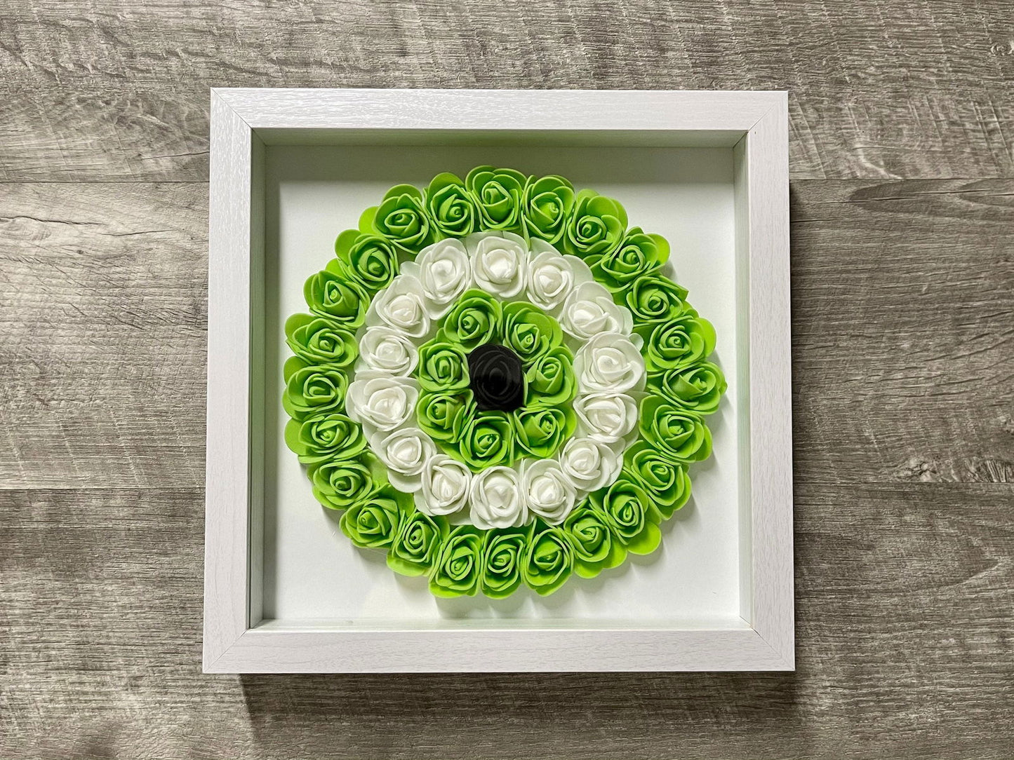 Handmade evil eye rose shadowbox with lime green and white coil rosette in white frame