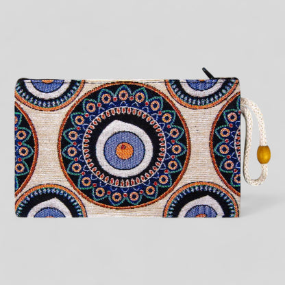 Blue kilim-pattern zip pouch with evil eye mandala and gold tassel zipper pull