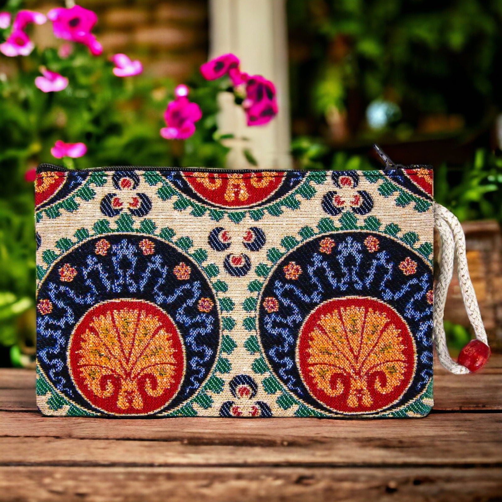 Colorful zippered clutch purse with ornate geometric tile pattern, navy and gold.