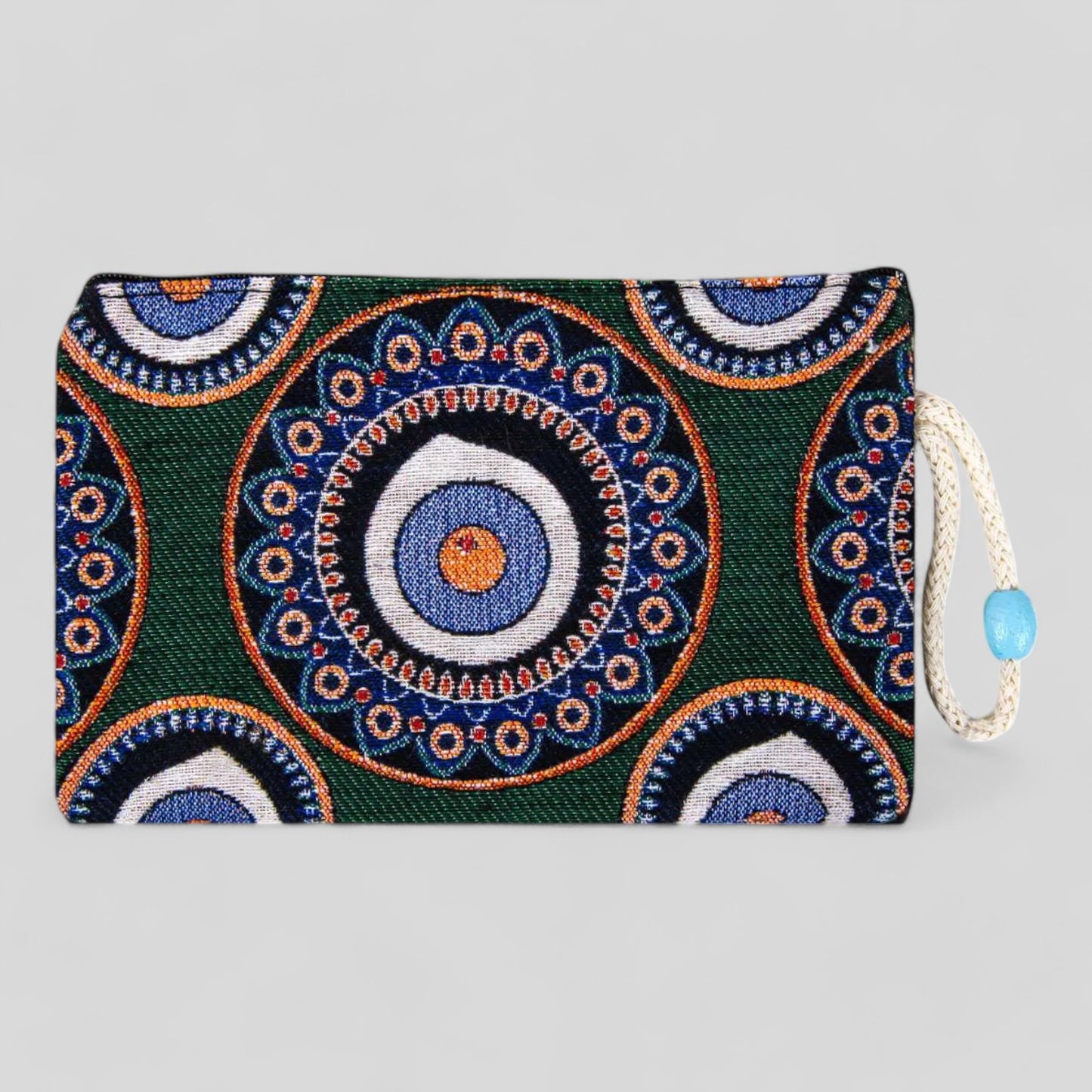 Green kilim clutch purse with blue and orange evil eye mandala, zipper top and cord pull