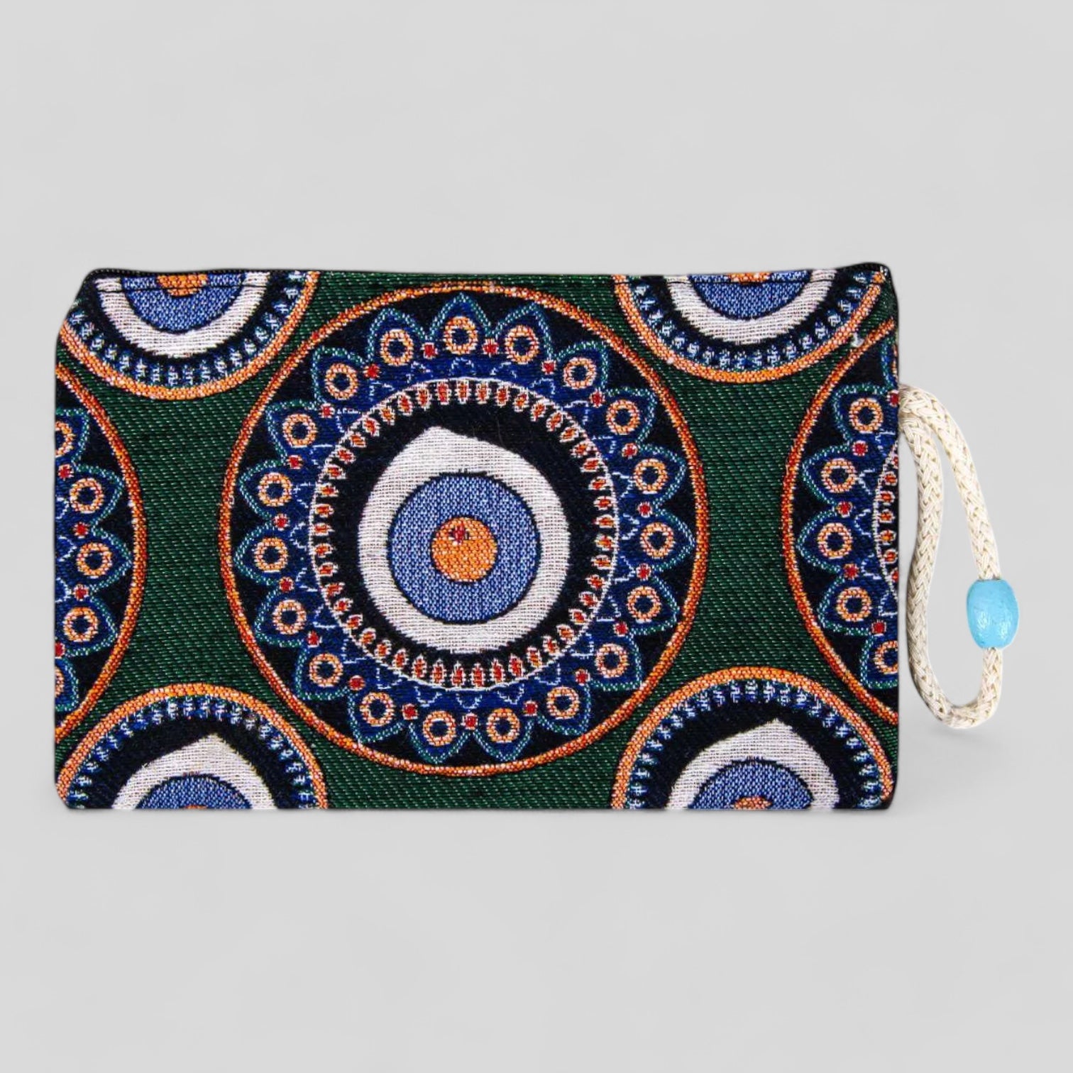 Green kilim clutch purse with blue and orange evil eye mandala, zipper top and cord pull