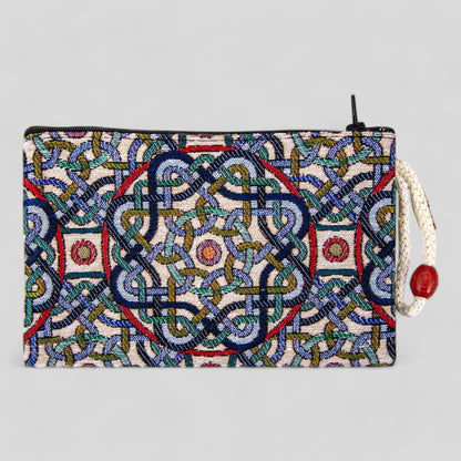 Multicolor geometric patterned zipper clutch pouch with red side tassel