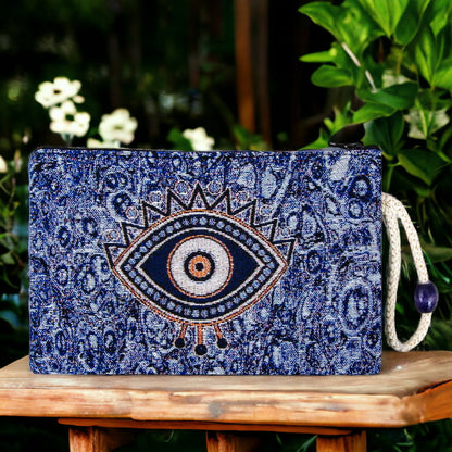 Blue evil eye patterned zip pouch with central eye motif