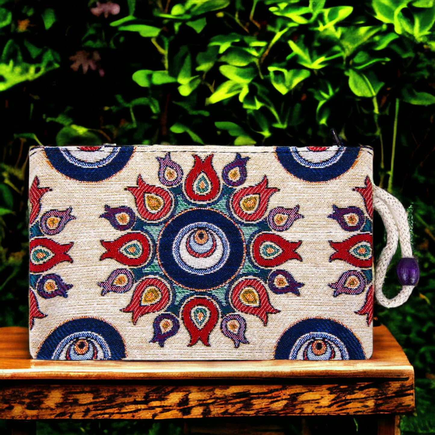 Kilim fabric zipper pouch with blue and red evil-eye tulip pattern