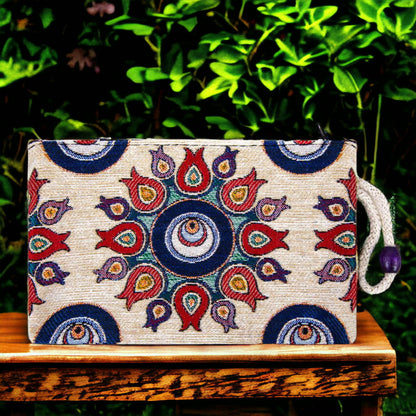 Kilim fabric zipper pouch with blue and red evil-eye tulip pattern