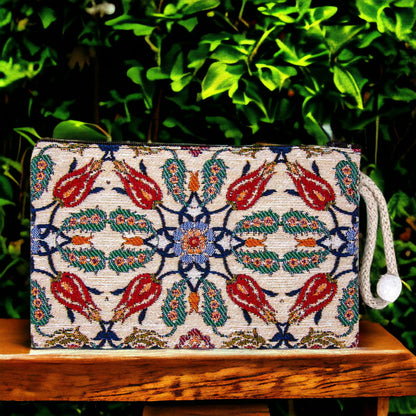 Kilim-style zipper clutch purse with red tulip pattern and blue border, cream fabric