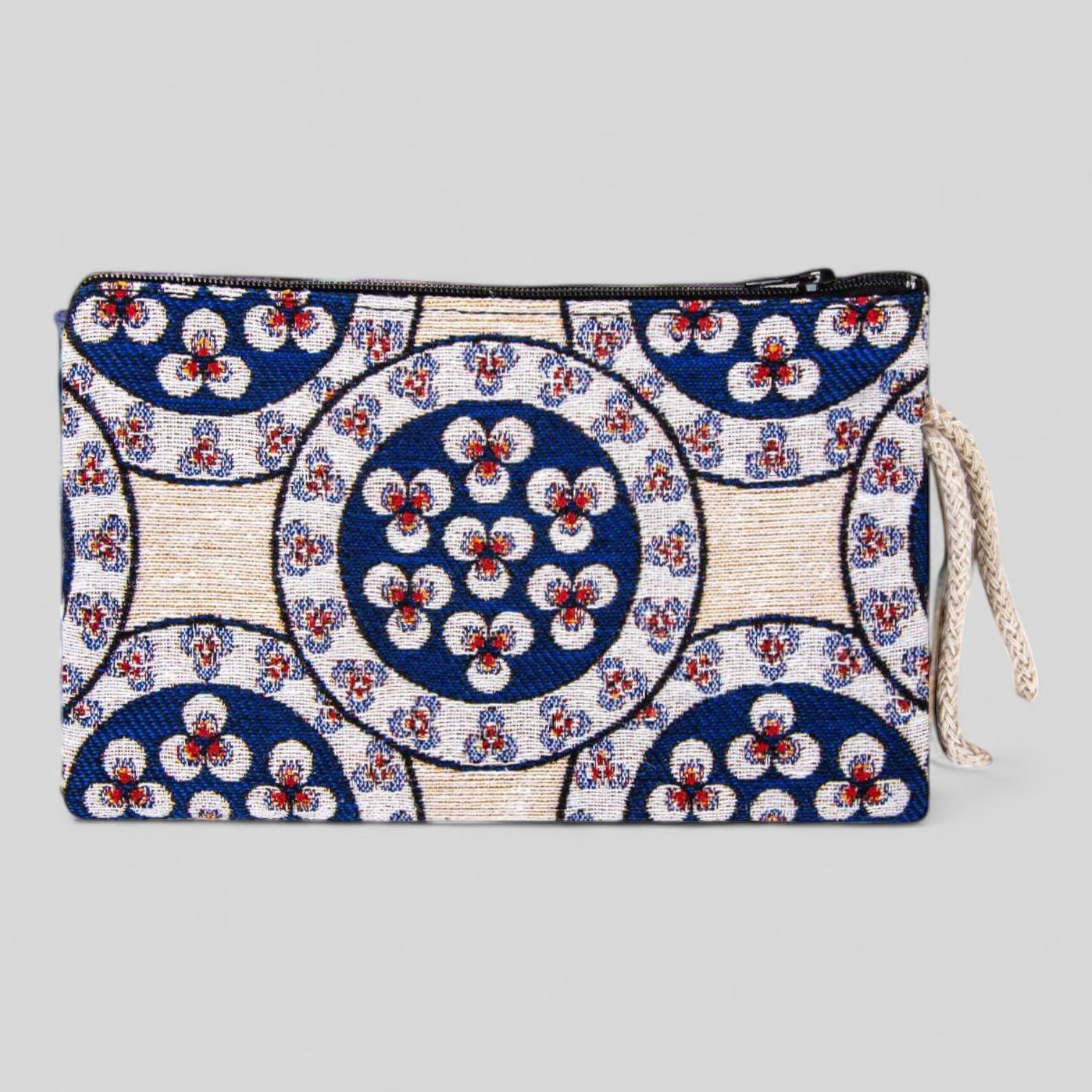 Kilim-style fabric zipper clutch purse with circular floral motifs, blue and white design
