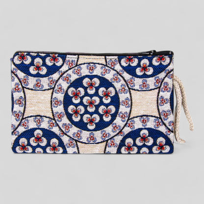 Kilim-style fabric zipper clutch purse with circular floral motifs, blue and white design