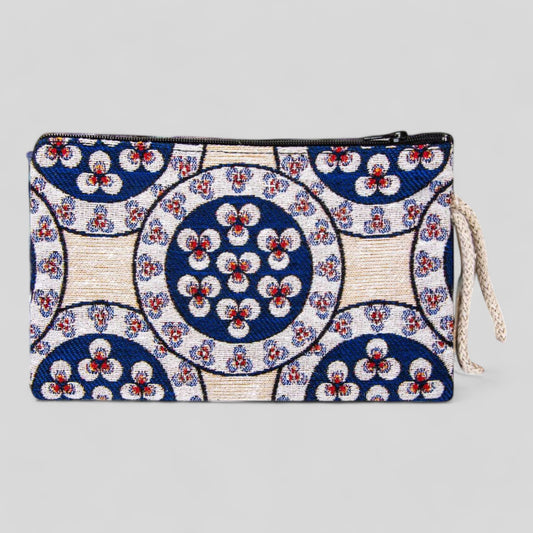Kilim-style fabric zipper clutch purse with circular floral motifs, blue and white design