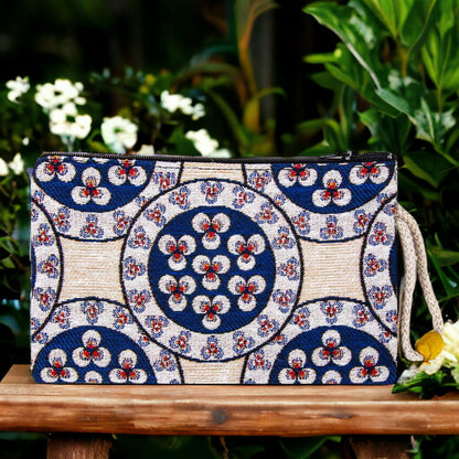 Blue and white circular motif zipper pouch clutch with wrist strap