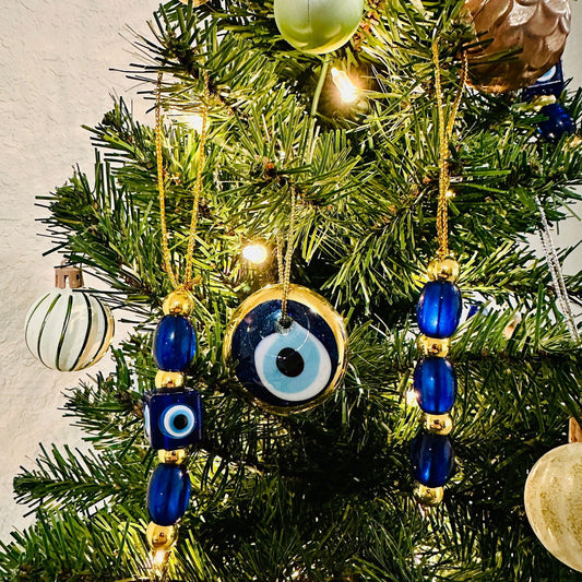 Blue-and-gold evil eye ornaments with round eye discs and bead tassel hangers