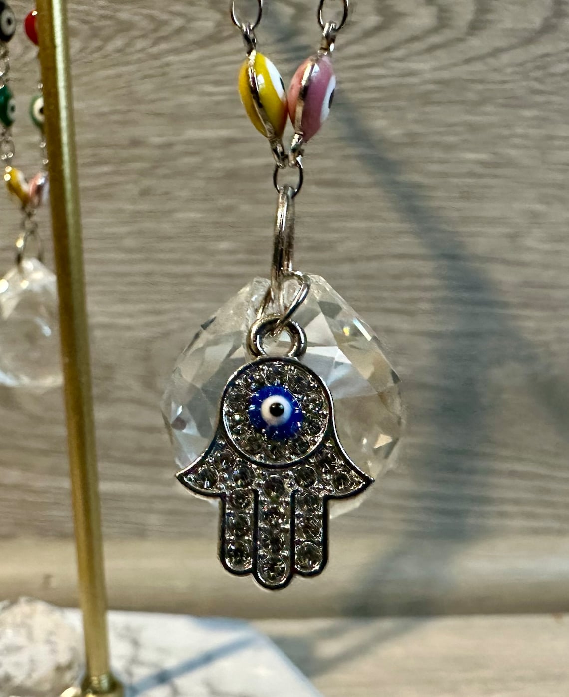 Silver evil eye hamsa rearview mirror charm with blue eye and clear crystal disc bead