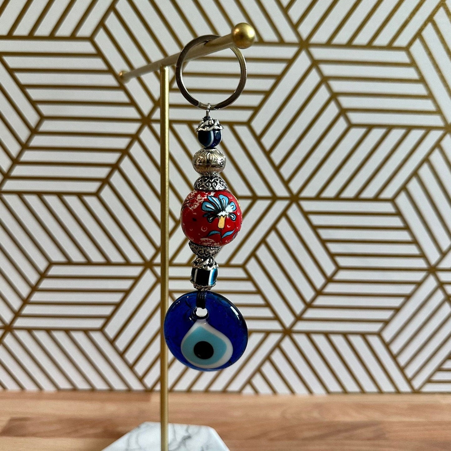 Evil eye ceramic keychain with red floral tulip bead and blue eye charm