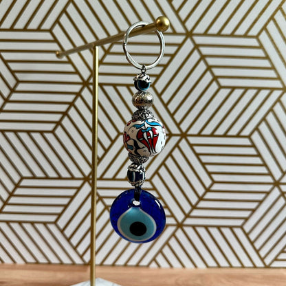 Evil eye keychain with white red floral ceramic charm and blue glass evil eye bead