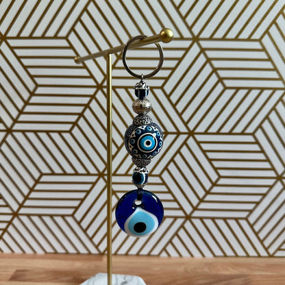Blue evil eye ceramic ball keychain with metal ring and dangling bead charms