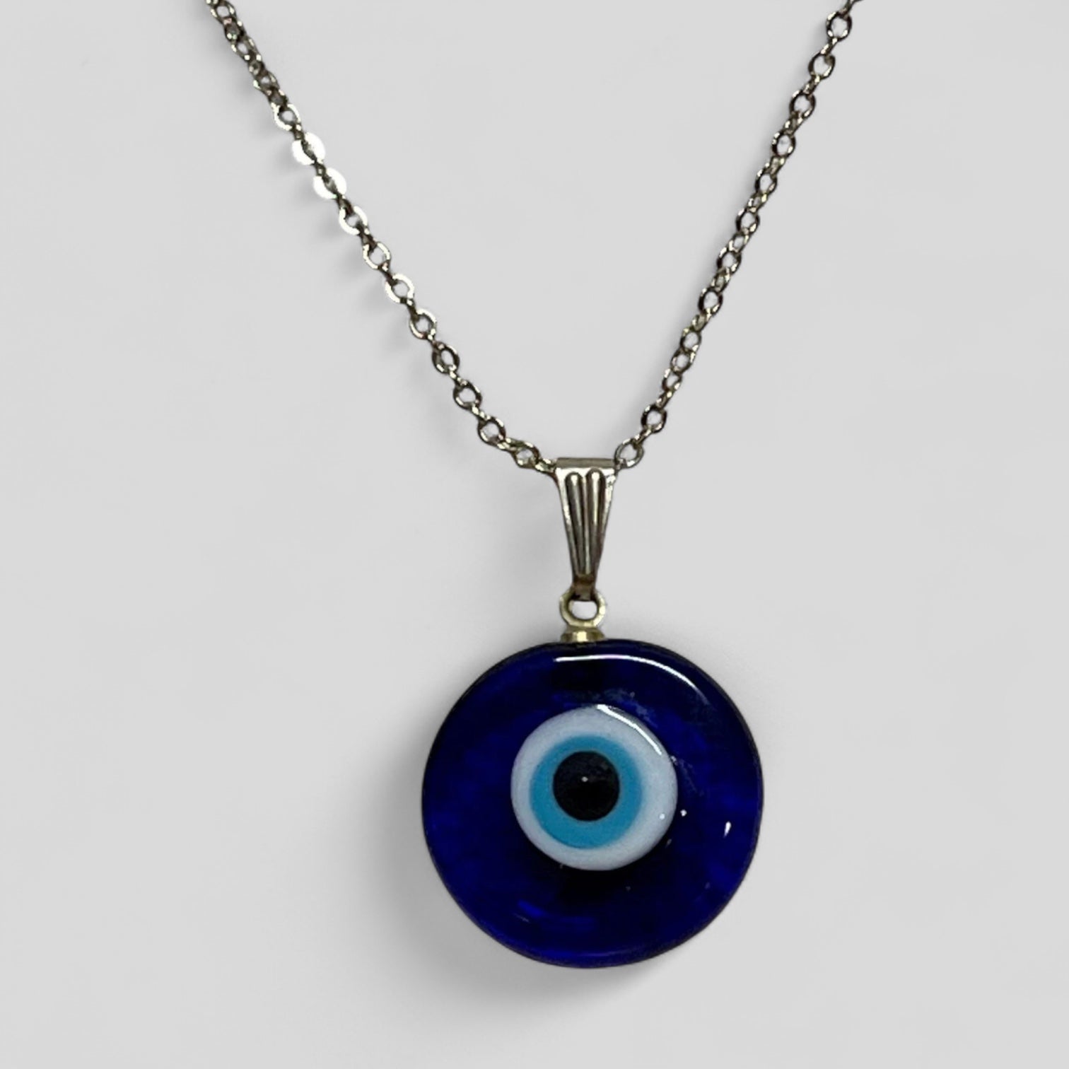 Evil eye pendant necklace with round blue glass charm and silver-tone chain