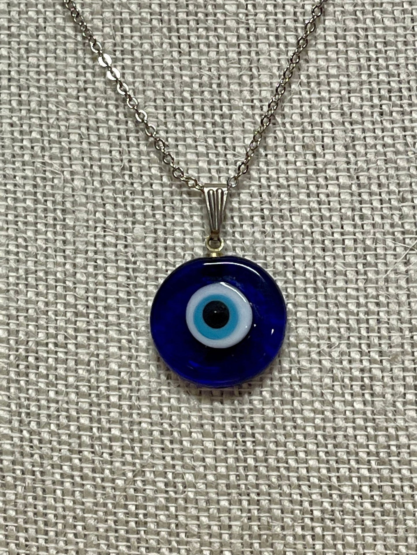 Dark blue evil-eye pendant necklace with silver chain and round glass charm