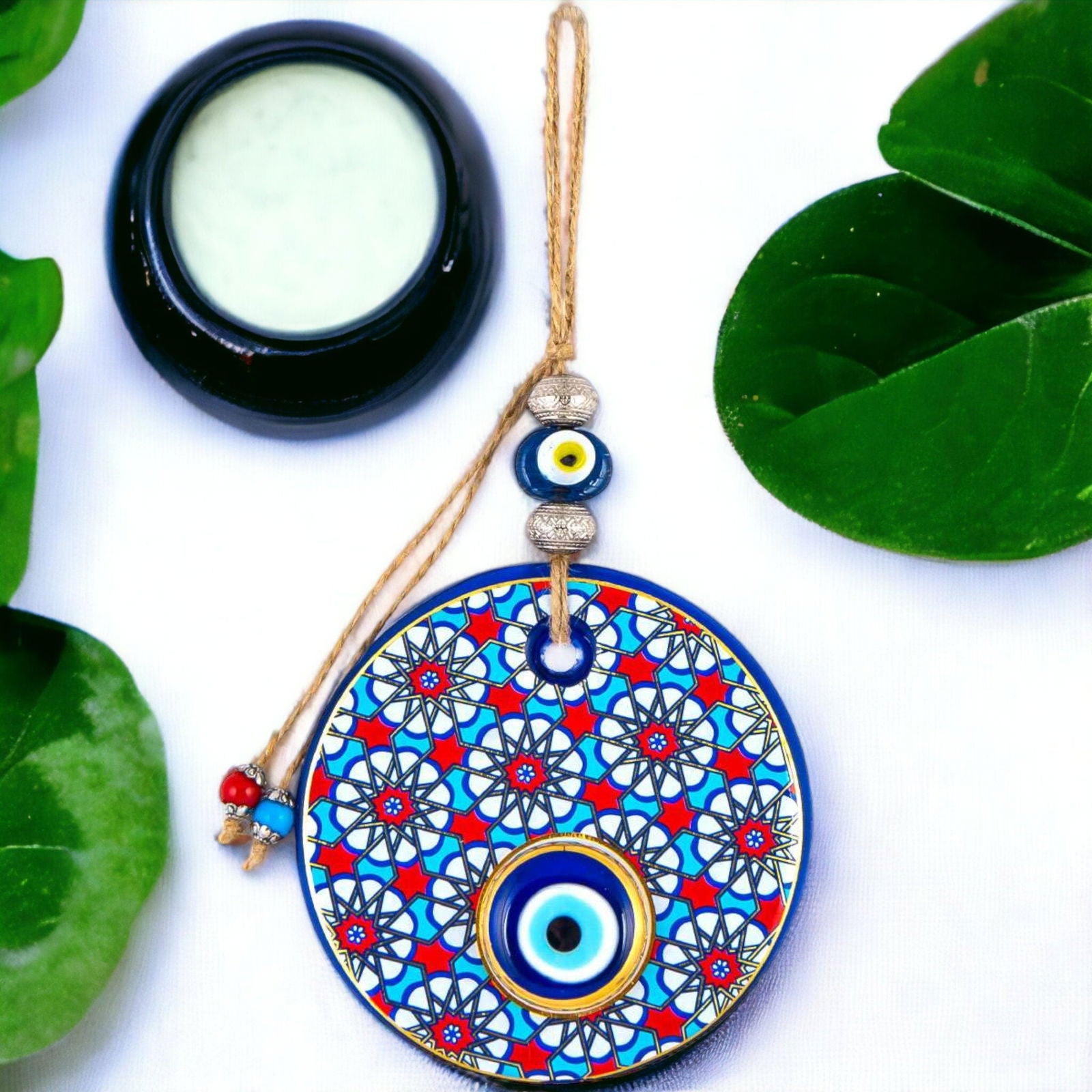 Evil eye wall hanging circular blue mosaic pendant with hanging cord and layered evil eye bead