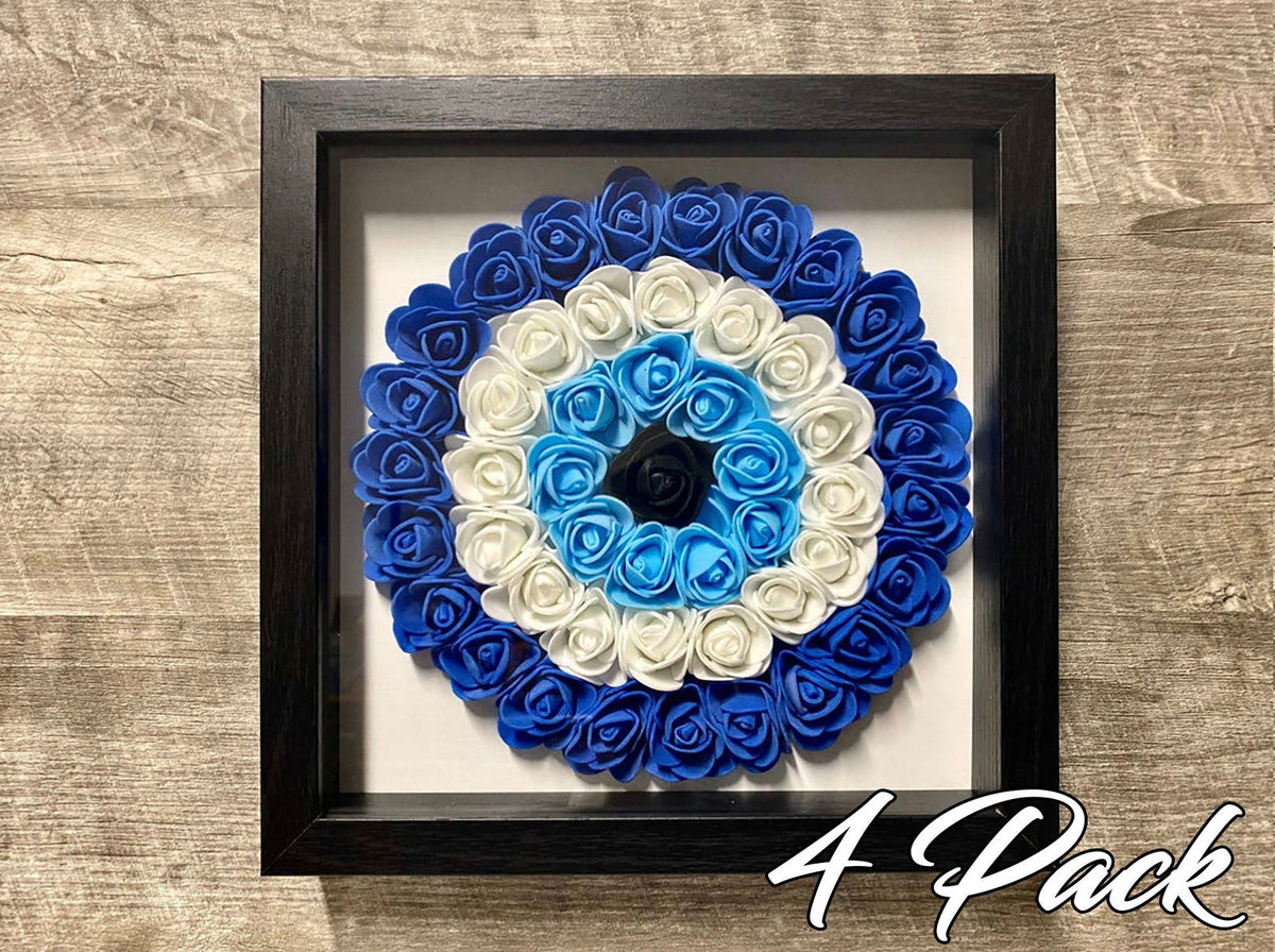 Black shadowbox wall hanging with blue-and-white evil eye rosette floral wreath