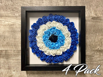 Black shadowbox wall hanging with blue-and-white evil eye rosette floral wreath