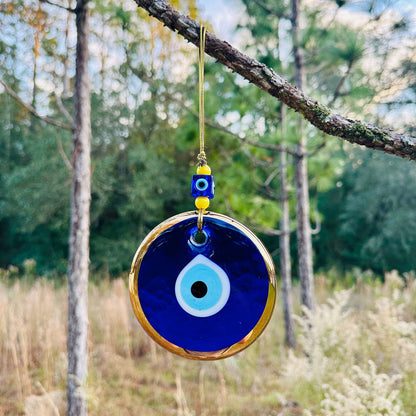 Gold and blue evil eye wall hanging charm with hanging loop cord