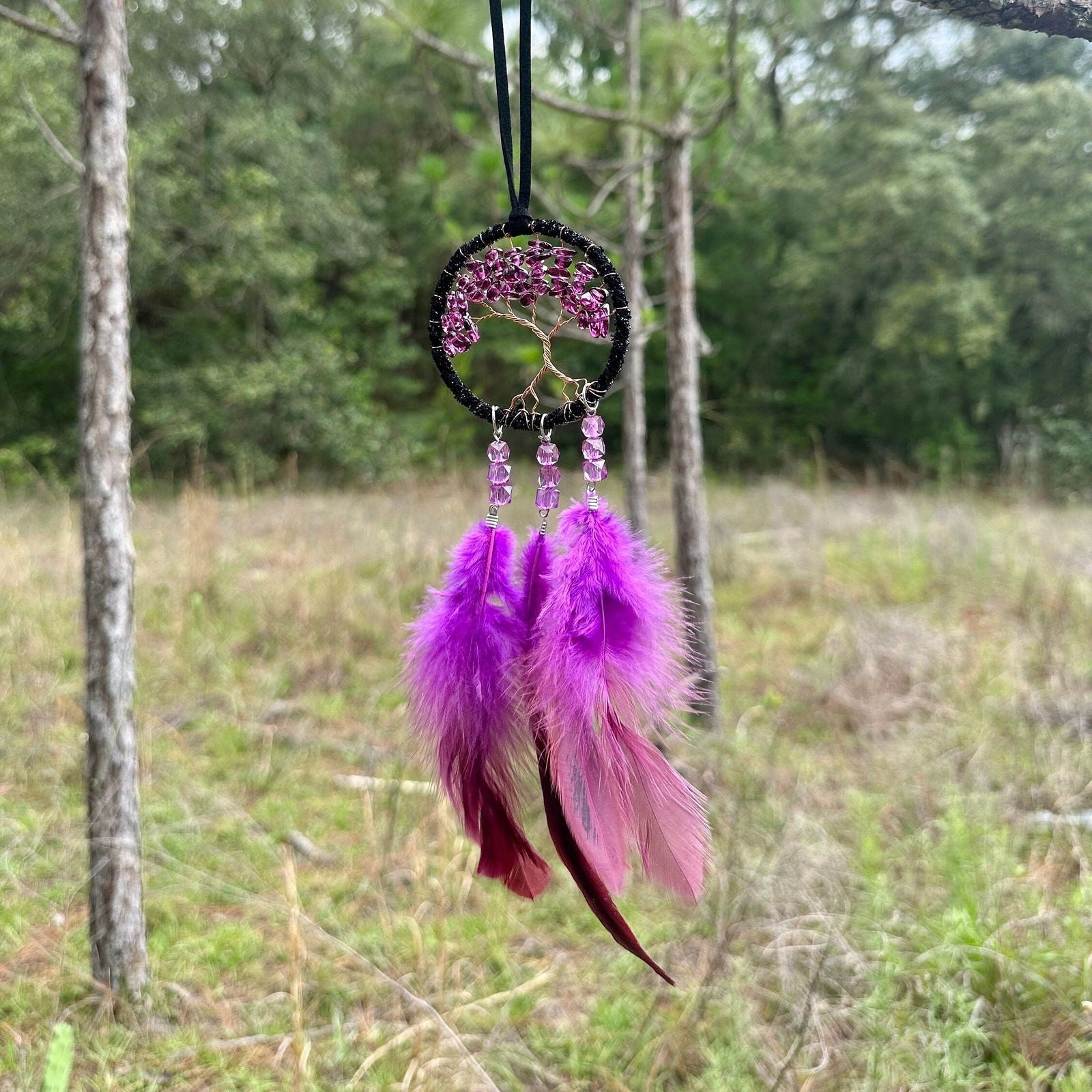 Handmade dark purple dreamcatcher with tree-of-life web and hanging purple feather strands