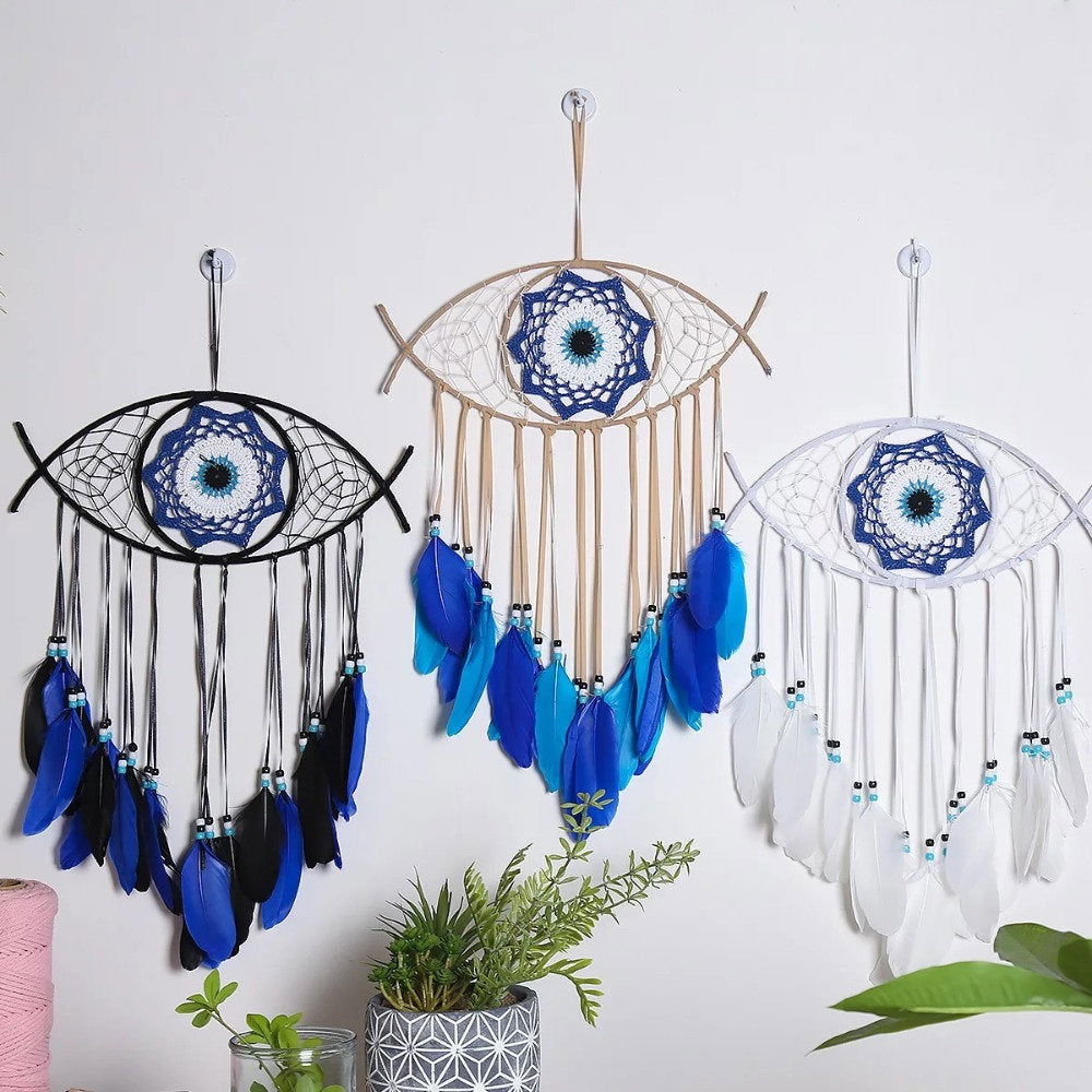 Set of three evil-eye dream catchers with blue feathers and black or white net frames