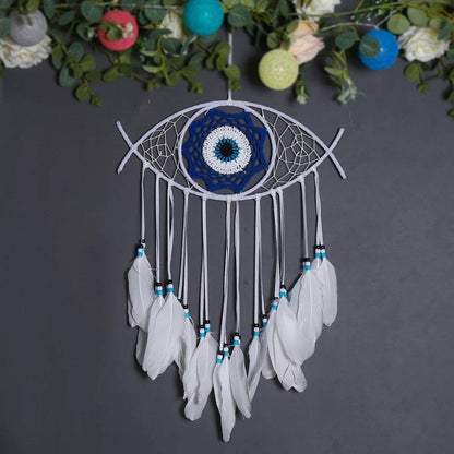Evil-eye dream catcher wall hanging with blue center and white feathers with beaded trim