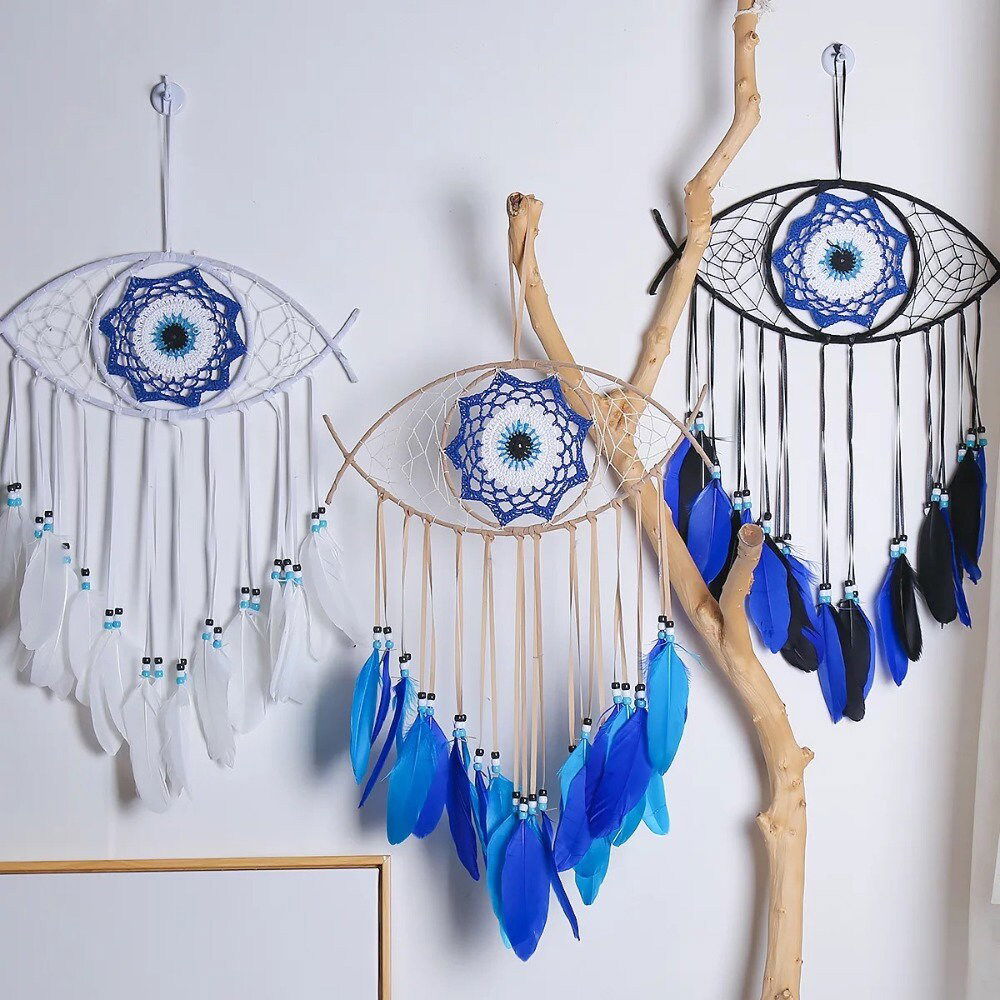 Evil-eye dream catcher wall hanging with blue feathers and silver fringe