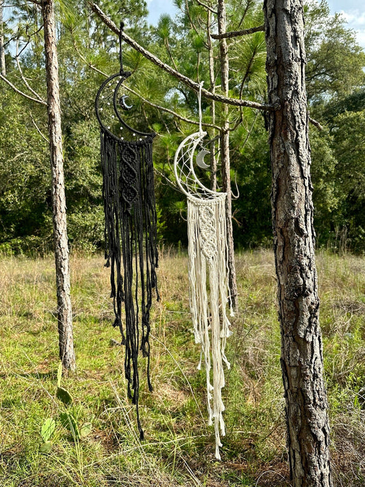Macrame dream catcher wall hanging with crescent moon charms, black and cream fringe