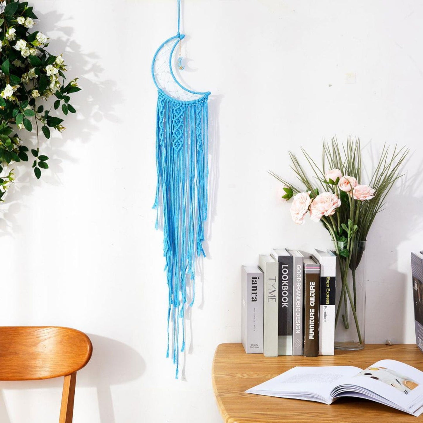 Light blue macrame crescent moon wall hanging with long tassels and moon charm