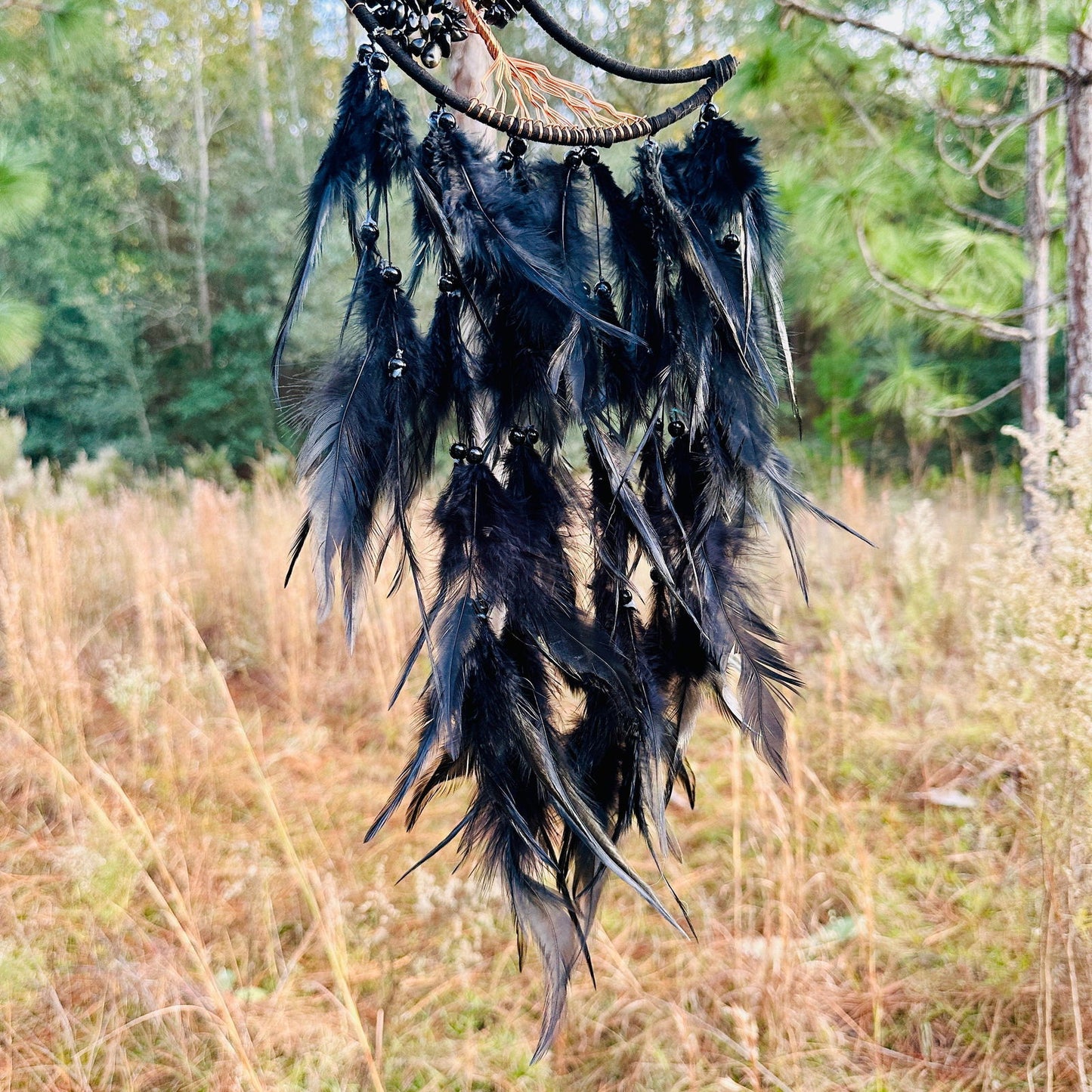 Crescent moon dream catcher with layered black feather fringe and beaded crescent ring