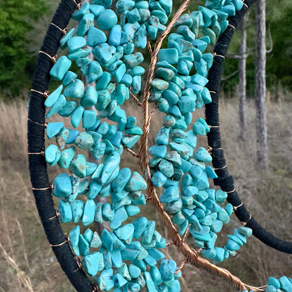 Crescent moon dream catcher close-up with turquoise stone beadwork and wire accents