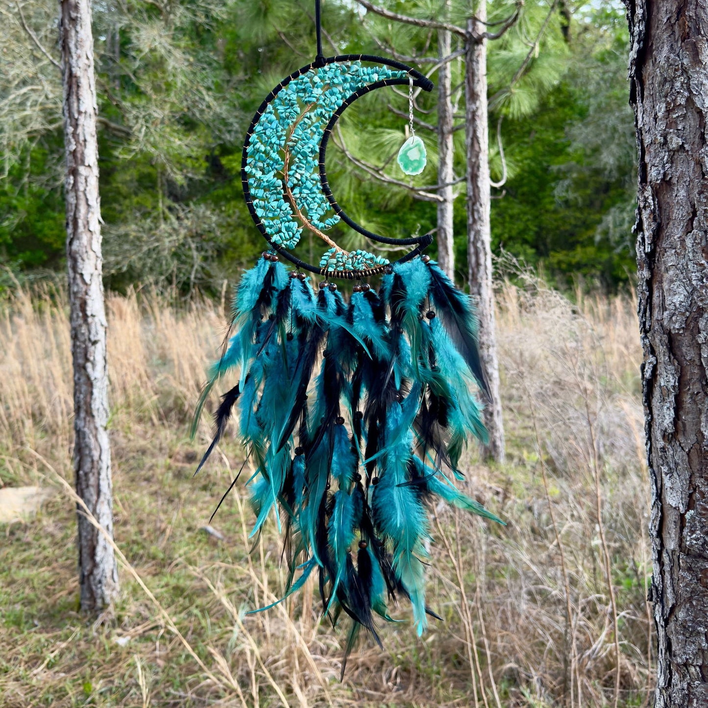 Crescent moon dream catcher wall hanging with turquoise stones and blue feathers