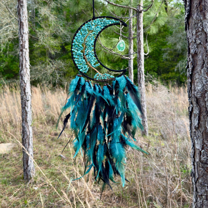 Crescent moon dream catcher wall hanging with turquoise stones and blue feathers