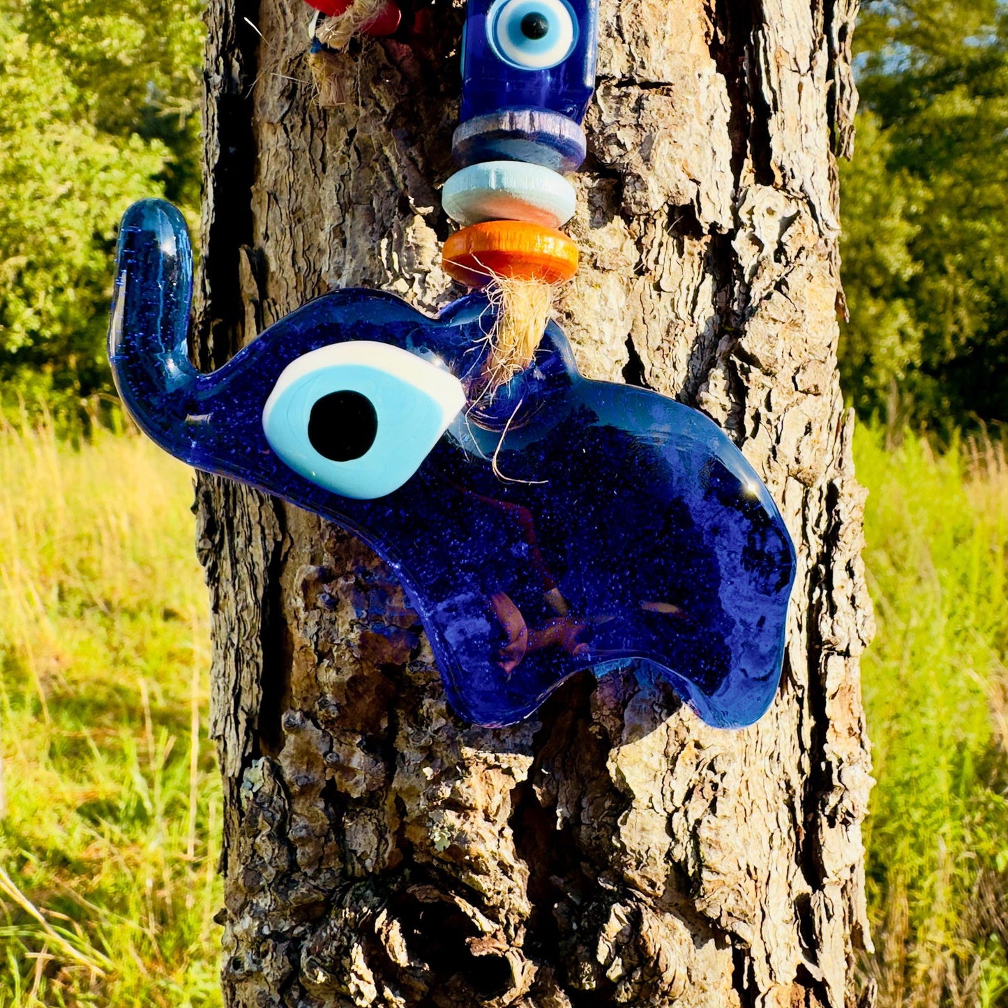 Blue mini elephant evil eye wall hanging with large blue eye and stacked beads