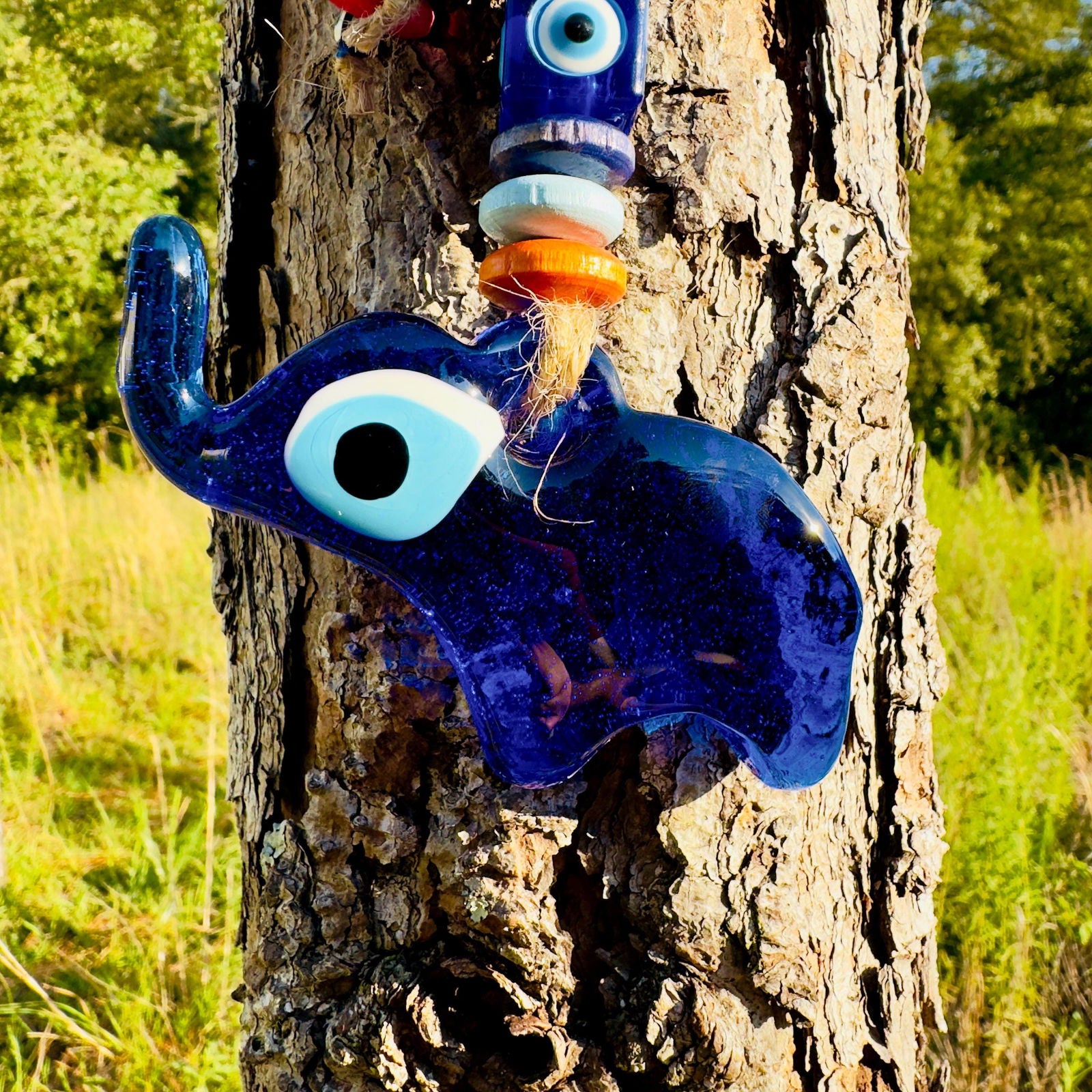 Blue mini elephant evil eye wall hanging with large blue eye and stacked beads