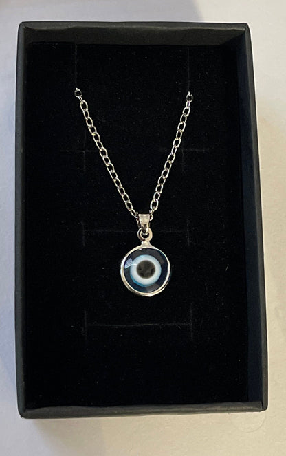Mini evil eye pendant necklace, round blue-and-white charm on silver chain