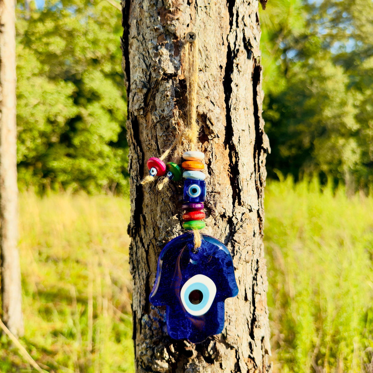 Blue hamsa evil eye charm with stacked wooden beads wall hanging