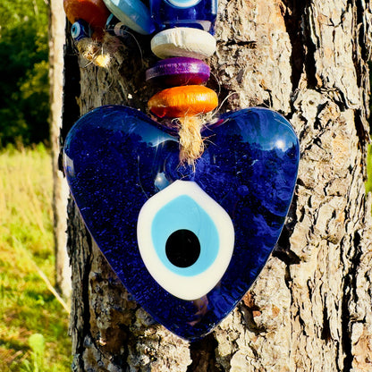 Blue heart evil eye wall hanging with white-and-blue eye detail and colorful beads
