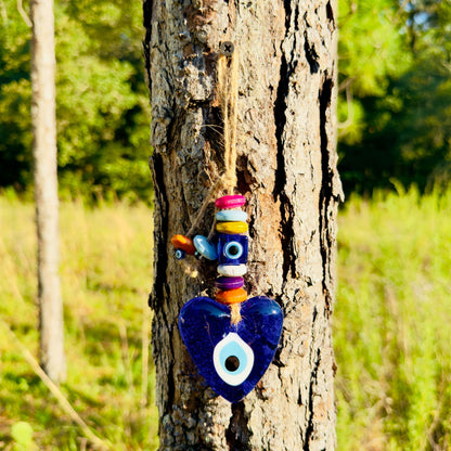 Blue heart evil eye wall hanging with hanging multicolor beads and twine tassel
